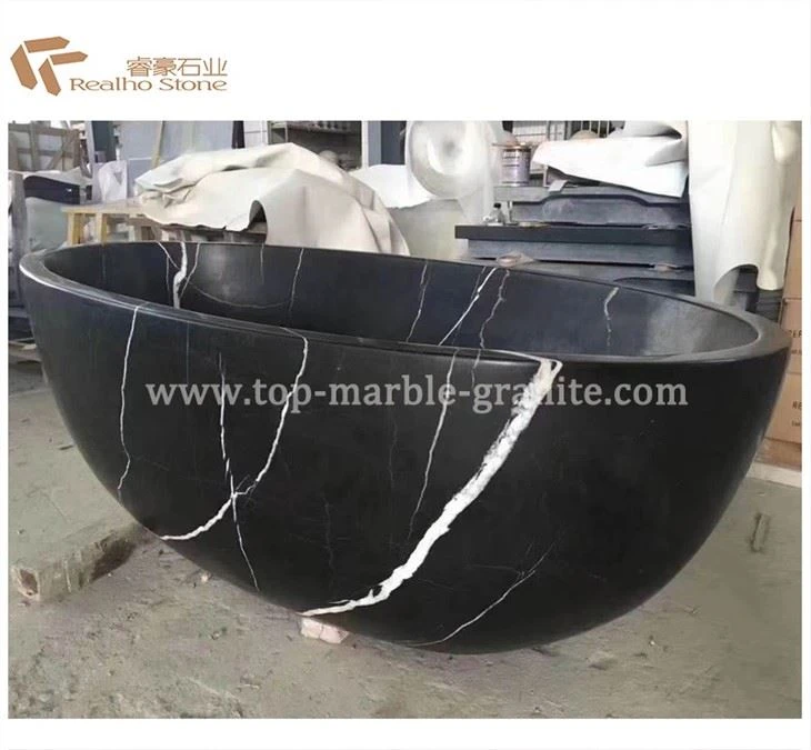 freestanding black marble bathtub